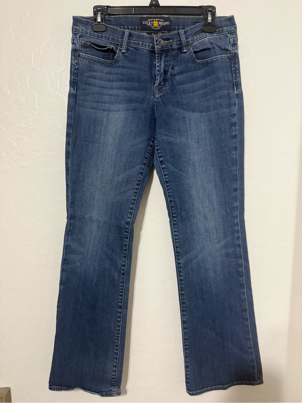 Lucky Brand Sweet N’ Low Denim Bootcut Jeans in Mid Blue Wash.